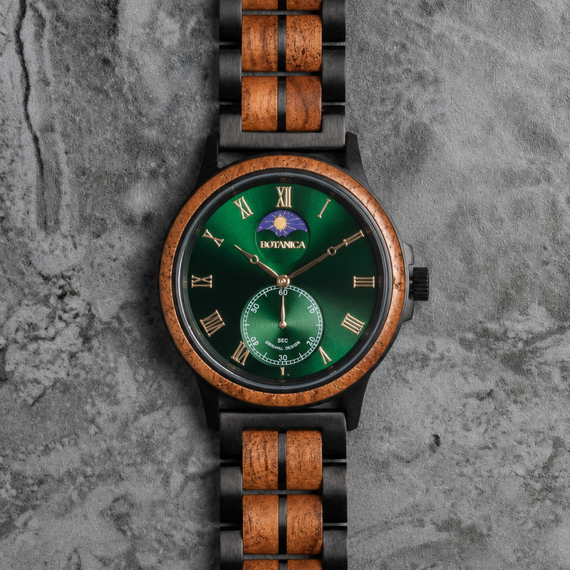 A wristwatch with a green dial, a wood-grain bezel and links, and black accents, photographed from above on a textured gray surface.