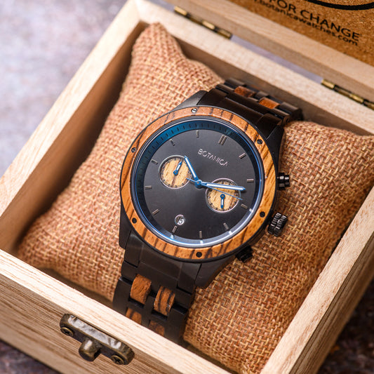 Mens 2 Dial Chronograph watch with zebrano wood bezel black stainless steel casement and blue inner dials wrapped around hessian sleeve in wooden watch box