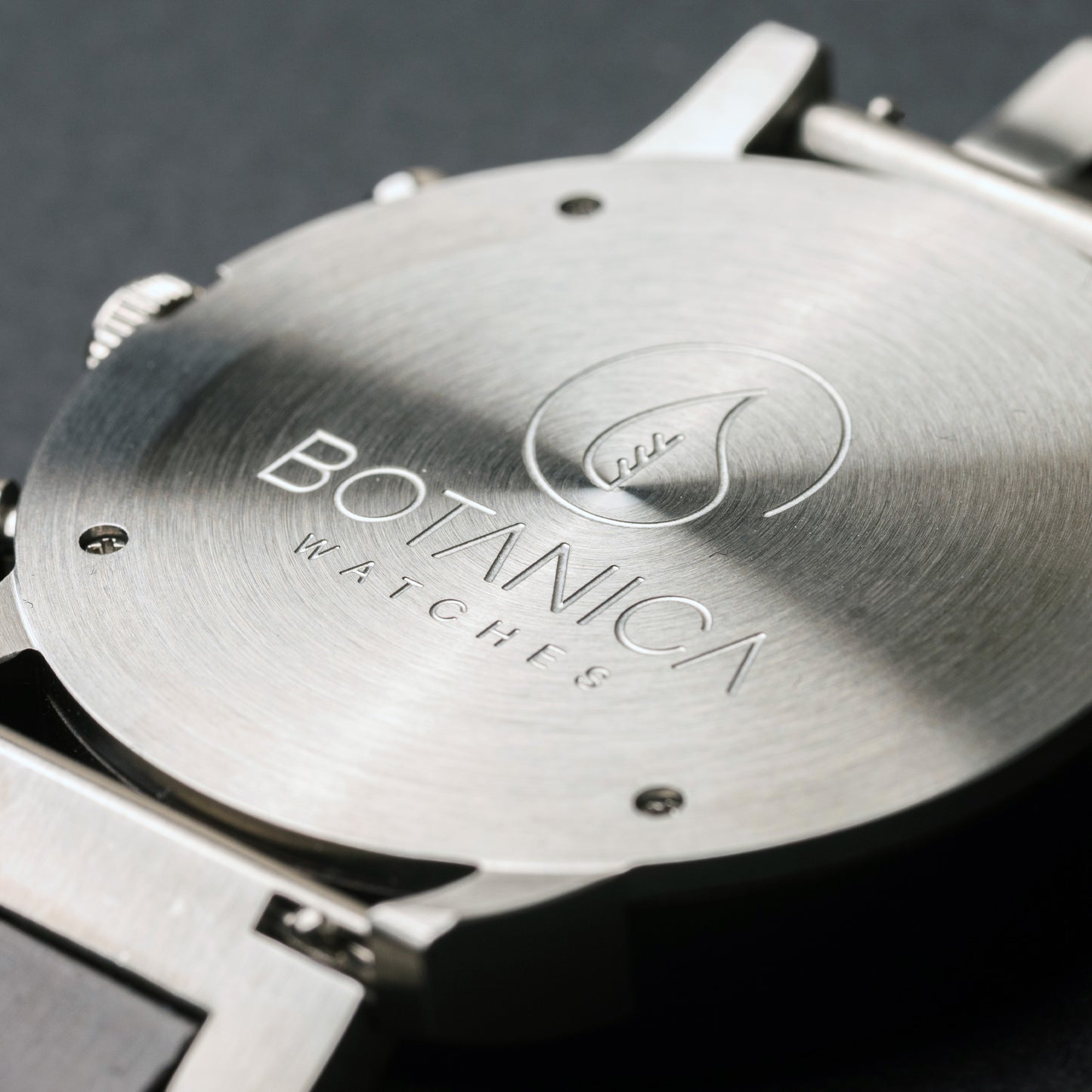 Close-up of a Botanica Watch on a dark background