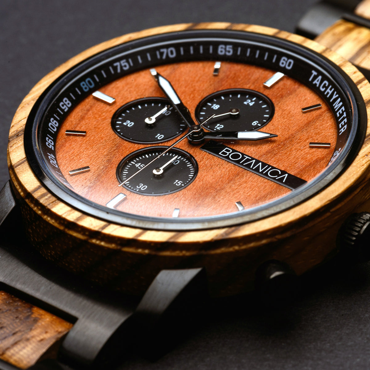 Zebrano Wooden watch with a detailed face on a dark background