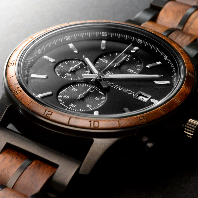 Walnut Wood Watch with Detailed subdials and black dial face on a black textured background