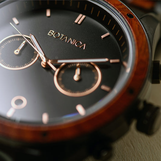 Detail of rosegold markings on Mens 44mm chronograph watch with rosewood bezel