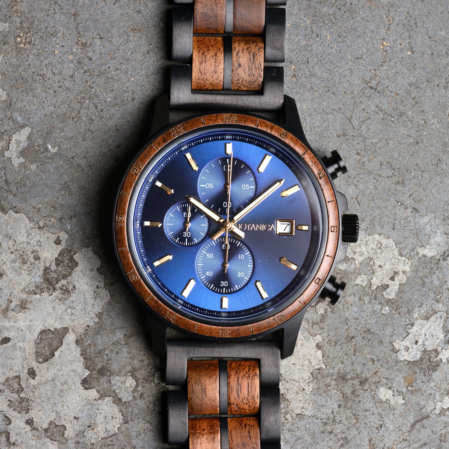 Wristwatch with wooden strap on a textured surface