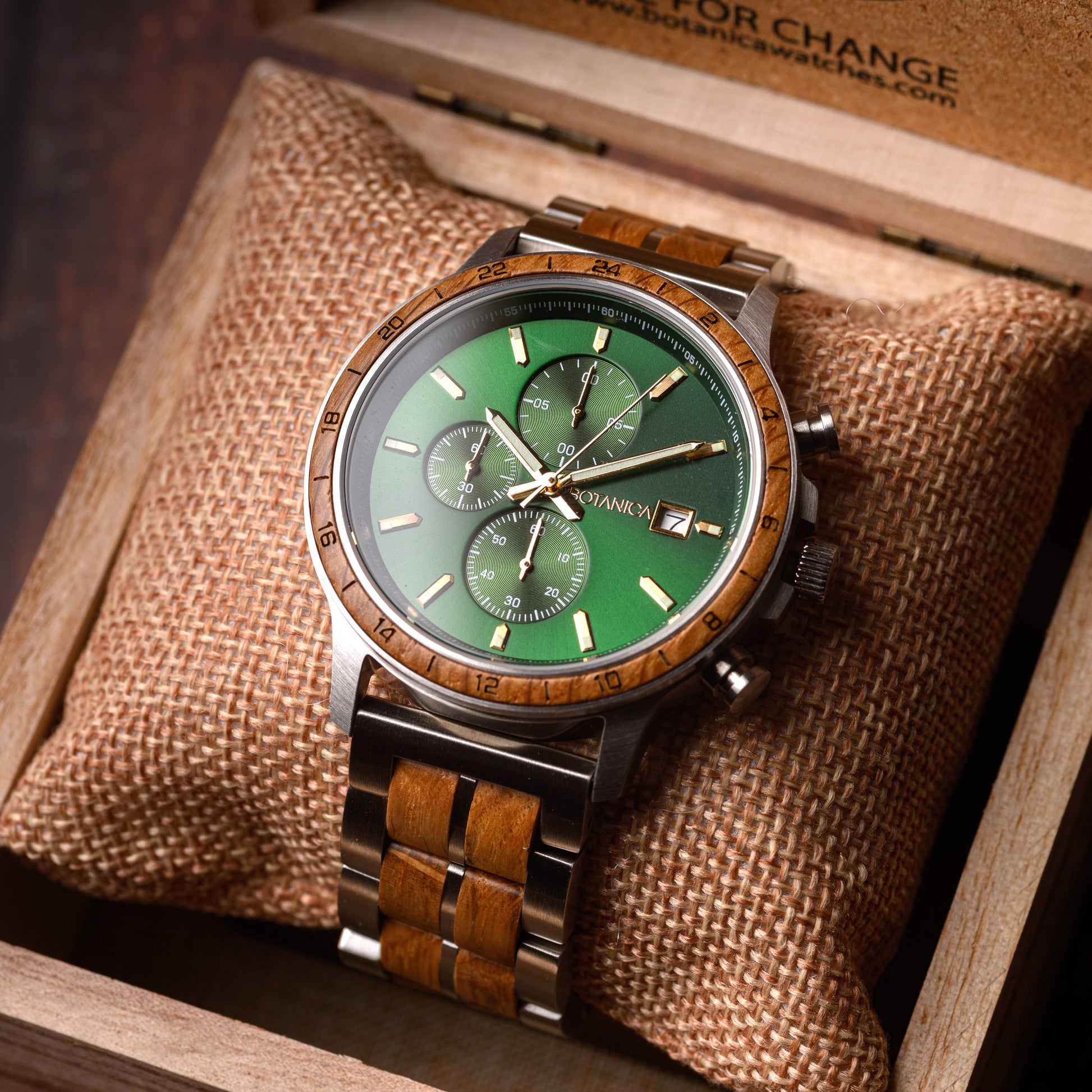 Wooden watch with green face in a wooden box