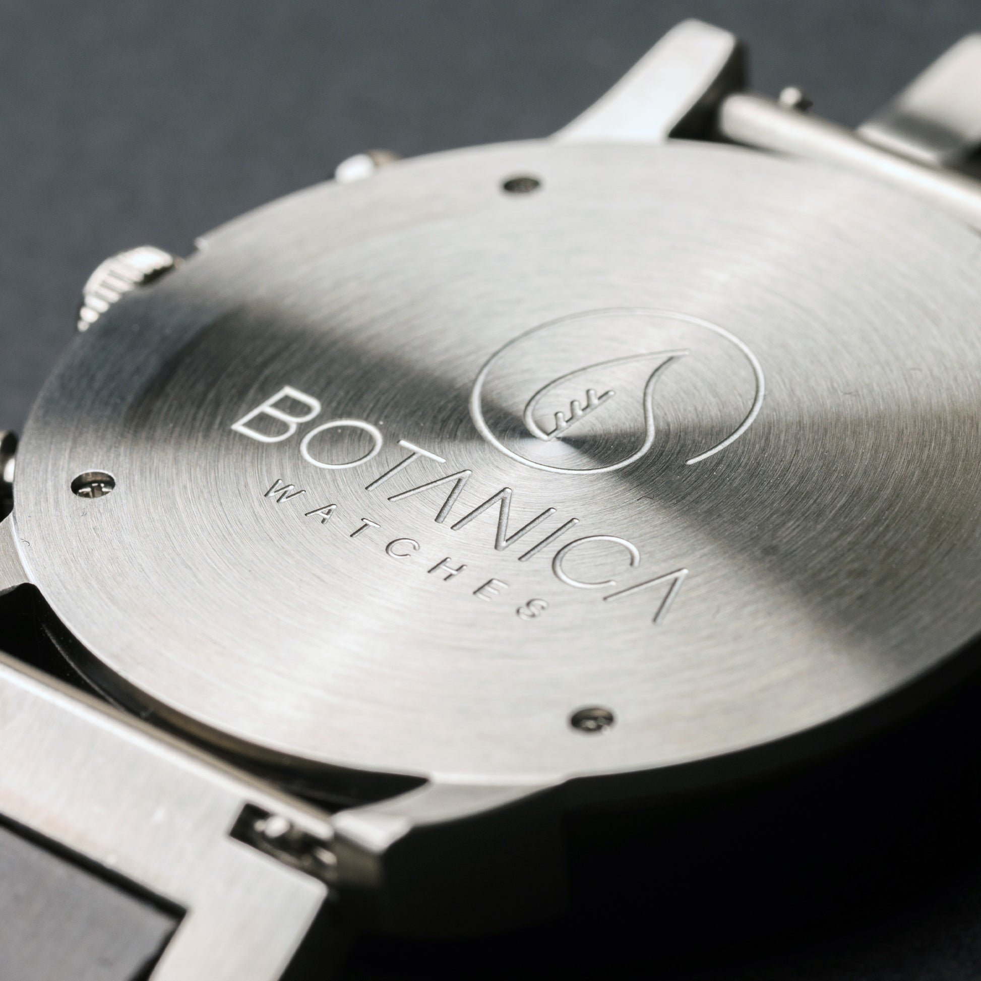 Close-up of a Botanica Watch on a dark background
