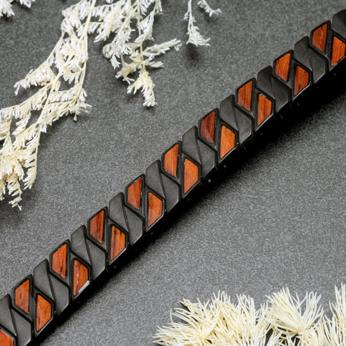 Bracelet with wooden and black design on a textured surface