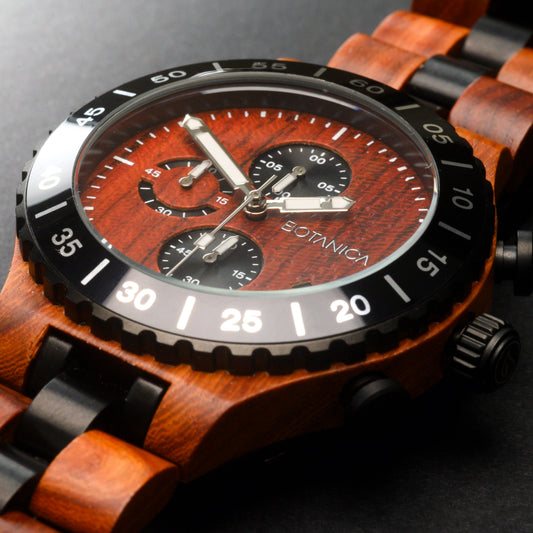 Wooden watch with a Rosewood face on a dark background