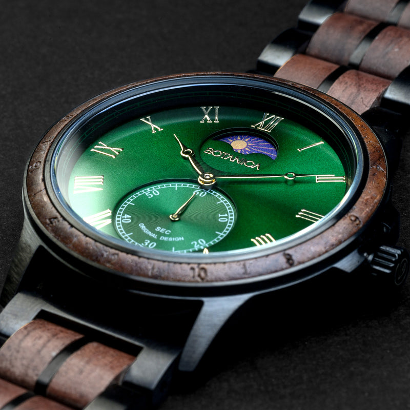 Watch with a green face and wooden strap on a dark background