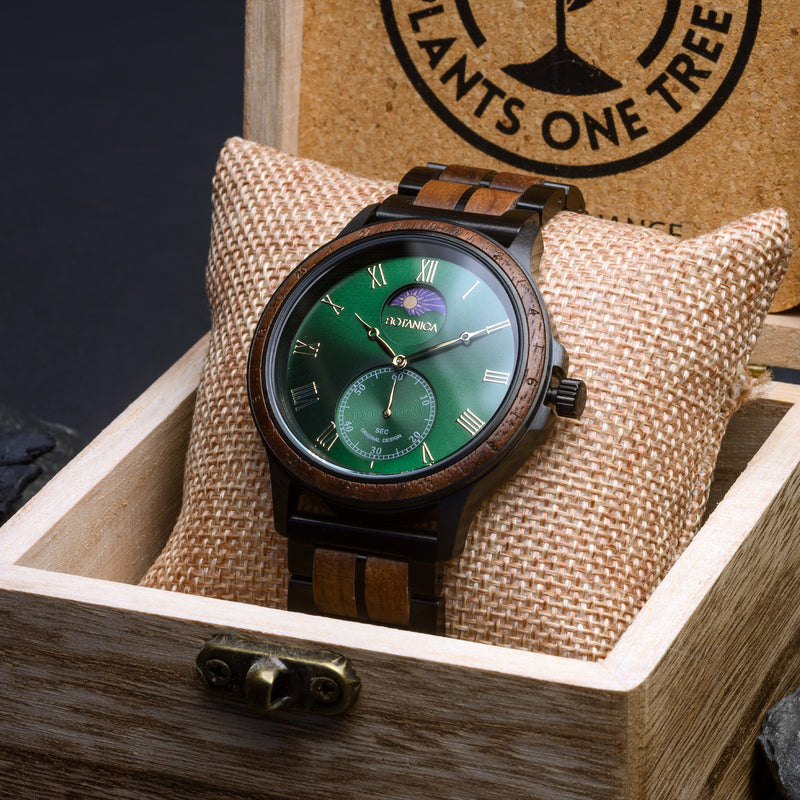 Wooden wristwatch with green face in a wooden box, brand 'Pants One Tree' visible