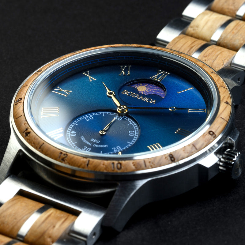 Watch with wooden strap and blue face on a dark background