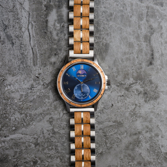Watch with a blue face and wooden and metal strap on a textured gray background