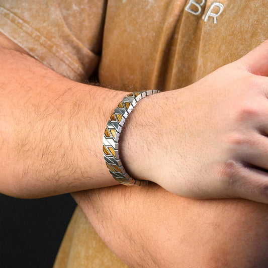 Close-up of a wrist wearing a silver and Wood bracelet.