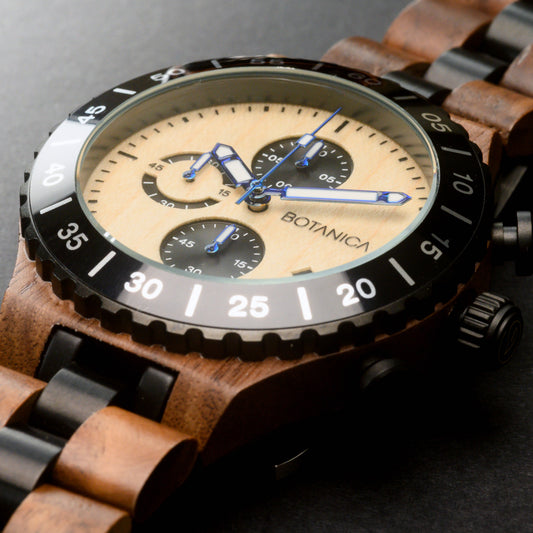 Walnut Wooden watch with a maple wood face on a dark background