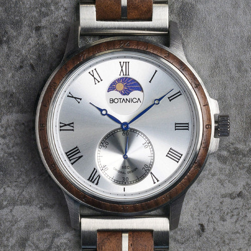 Watch with wooden and metal strap on a textured gray background