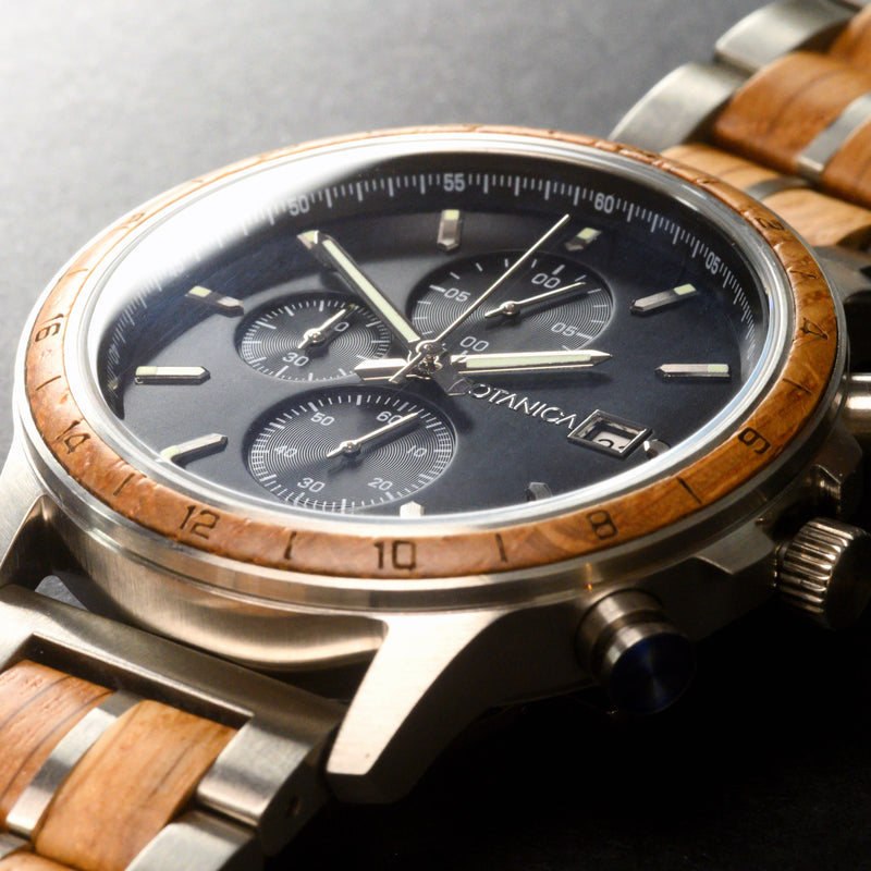 Whiskey Wood watch with a wooden strap and a detailed subdial face on a dark background